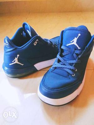 Pair Of Blue Air Jordan Basketball Shoes