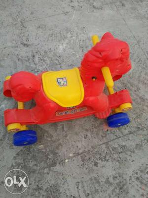 Red And Yellow Plastic Ride On Horse