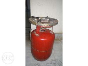 Small gas cylinder with burner on top. This is