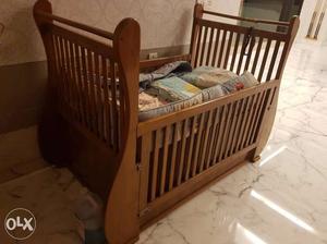 Solid teak wood baby crib. seen 4 kids through in
