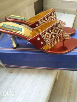 Women's Pair Of Gold And Red Pumps On Box