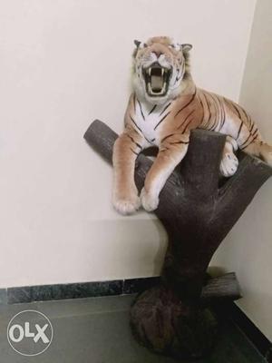 A cement made tree with tiger..can be used for