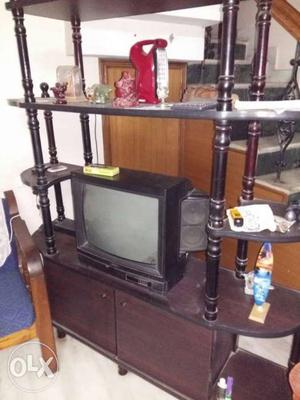 Onida black TV in good working condition with stand.