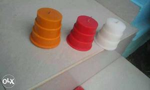 Three White, Red And Orange Candles