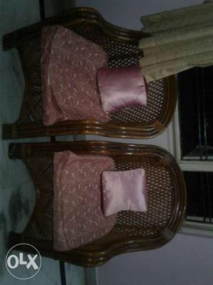 Two Pink Floral Suede Padded Brown Rattan Armchairs With Two