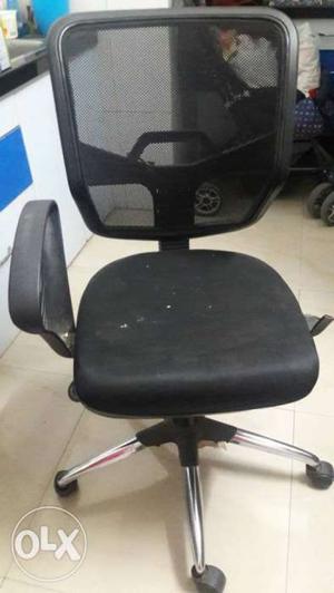 2 year old black office chair with wheels. one