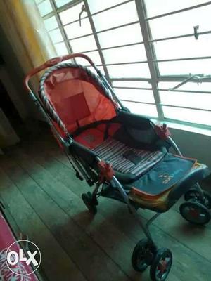 Baby's Black And Orange Stroller