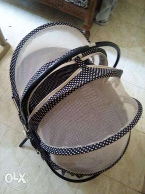 Baby's White And Black Stroller