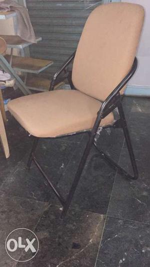 Black And Beige Folding Chair