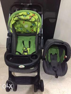Black And Green Stroller And Seat Carrier