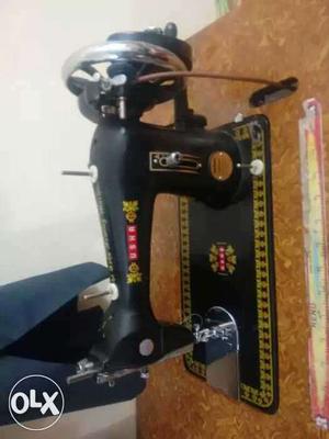 Black sewing machine of Usha