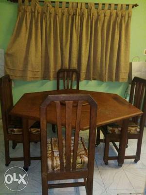 Hexagonal Brown Wooden Dining Table With Four Chairs