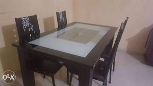 Rectangular Black And White Table And Four Chairs