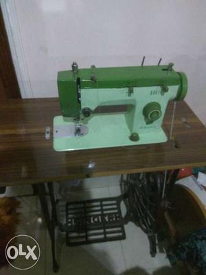White And Green Sewing Machine