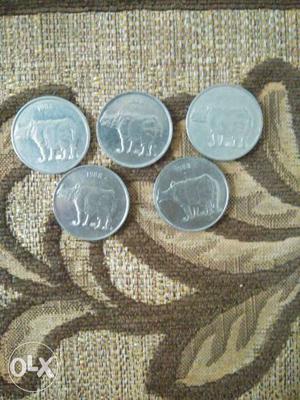 Five 25 paise coins of  with rhinoceros