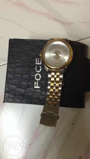 Foce Watch with gold silver colour..