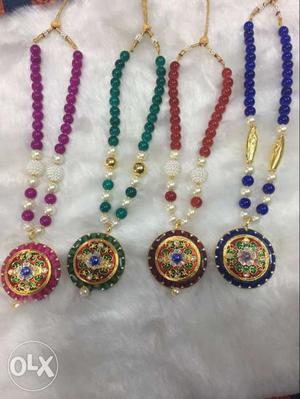Four Round Gold Pendant Beaded Necklaces