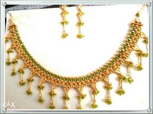 New unused Green crystal gold plated necklace