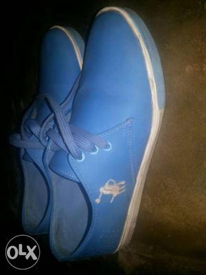 Pair Of Blue Low Top Sneakers