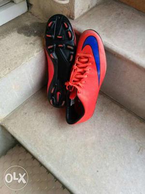 Pair Of Red And Blue Nike Cleats