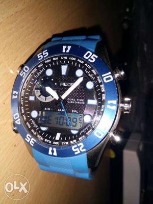 Round Black And Blue Rodex Chronograph Watch With Blue