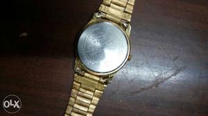 Sonata golden colour watch urgent want to sell