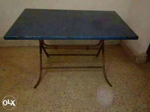 Used medium size metal folding table for sale.