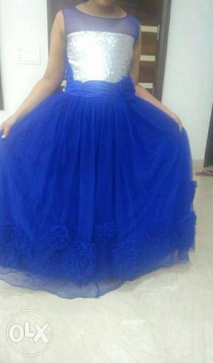 Blue colour girls full length gown. For girls of