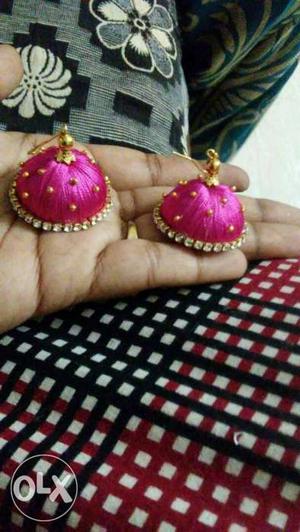 Pink-and-gold-colored Jhumka Earrings
