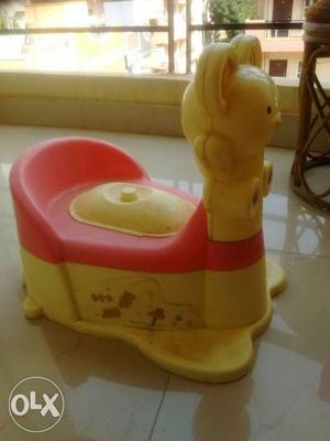 Pink and yellow potty seat