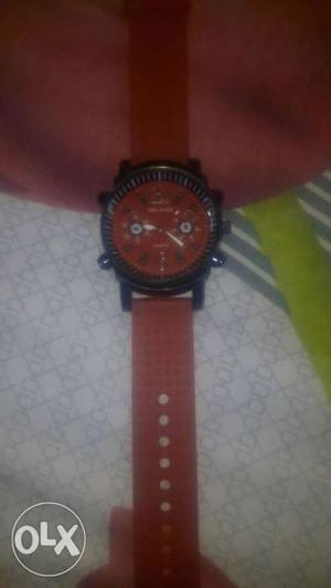 Round Black And Red Chronograph Watch With Red Strap