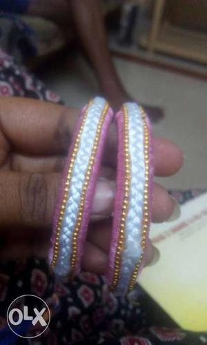 Two Pink-and-white Bracelets