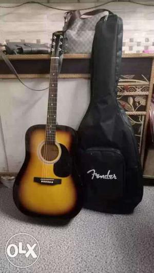 Brown And Black Fender Guitar