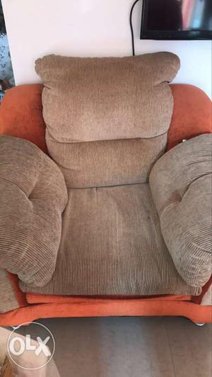 Brown And Orange Winged Sofa Chair