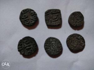 Five language written coins