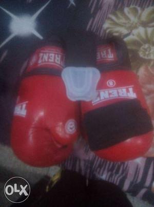 Pair Of Black And Red Trenz Boxing Gloves mouthguard boxing