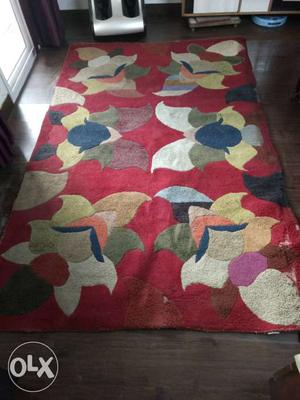 Red colour woolen design carpet 5-6 yrs old