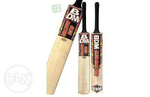 Three Brown-and-black BDM Cricket Bats