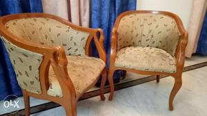 Two Brown Wooden Framed Armchairs