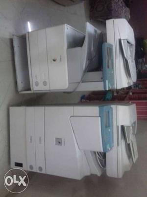 Two White-and-green Office Printers