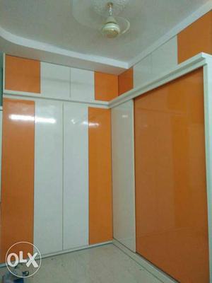 White And Orange Wooden Wardrobe