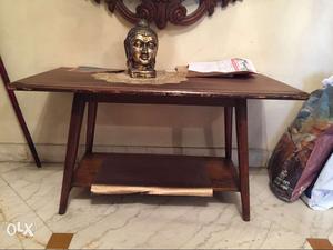 Wooden table with buddha figurine
