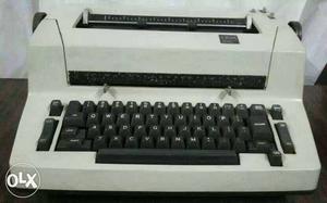White And Black Electric Typewriter