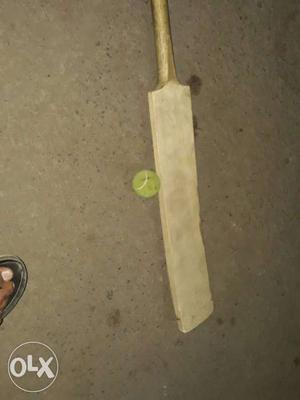 Beige Wooden Cricket Bat And Ball