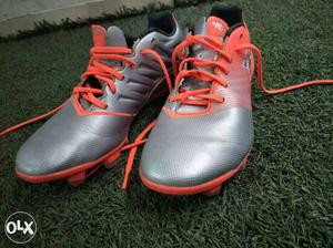 Gray-and-orange Cleats