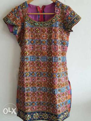 Multi coloured dress with handwork. zip in the