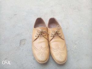 Pair Of Beige Leather Oxford Shoes