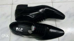 Pair Of Black LP Leather Shoes