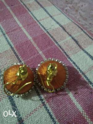 Pair Of Orange Jhumka Earrings