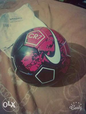 Red, White And Black Nike Soccer Ball